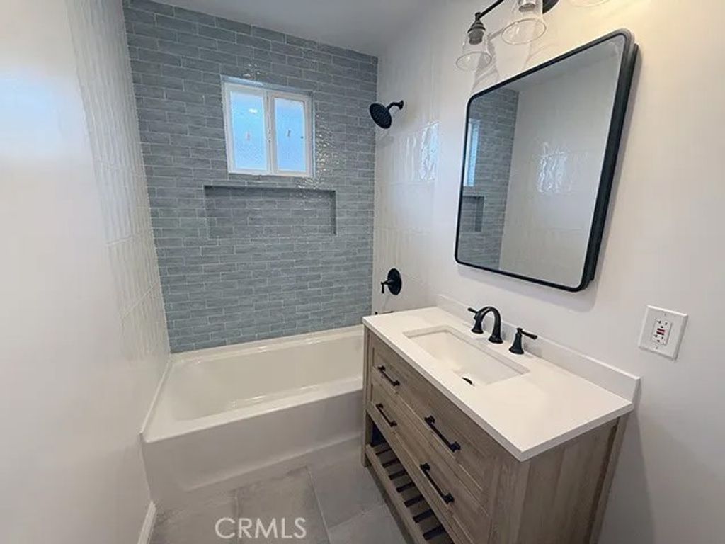 Photo of 13404 Purche Ave, Gardena, CA 90249 (MLS # SR26095424)