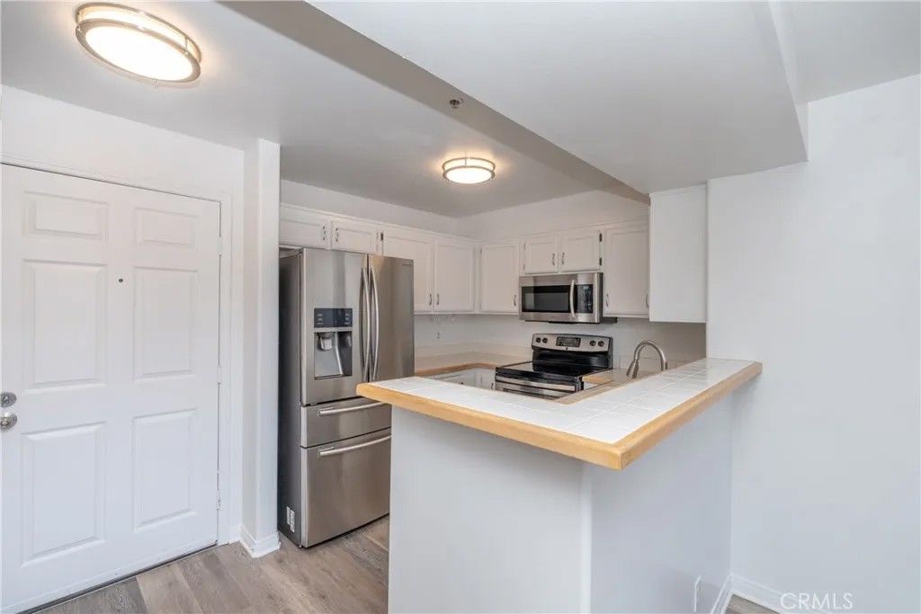 Photo of 11410 Brookshire Ave, Downey, CA 90241 (MLS # DW26020877)