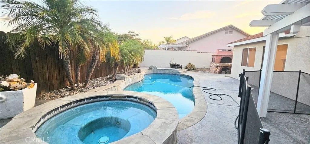 Photo of 23501 Mountain Breeze Dr, Murrieta, CA 92562 (MLS # SW26064264)