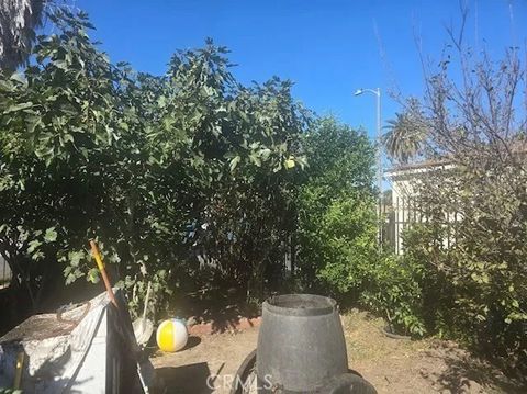 Photo of 10510 Towne Ave, Los Angeles, CA 90003 (MLS # OC26001948)