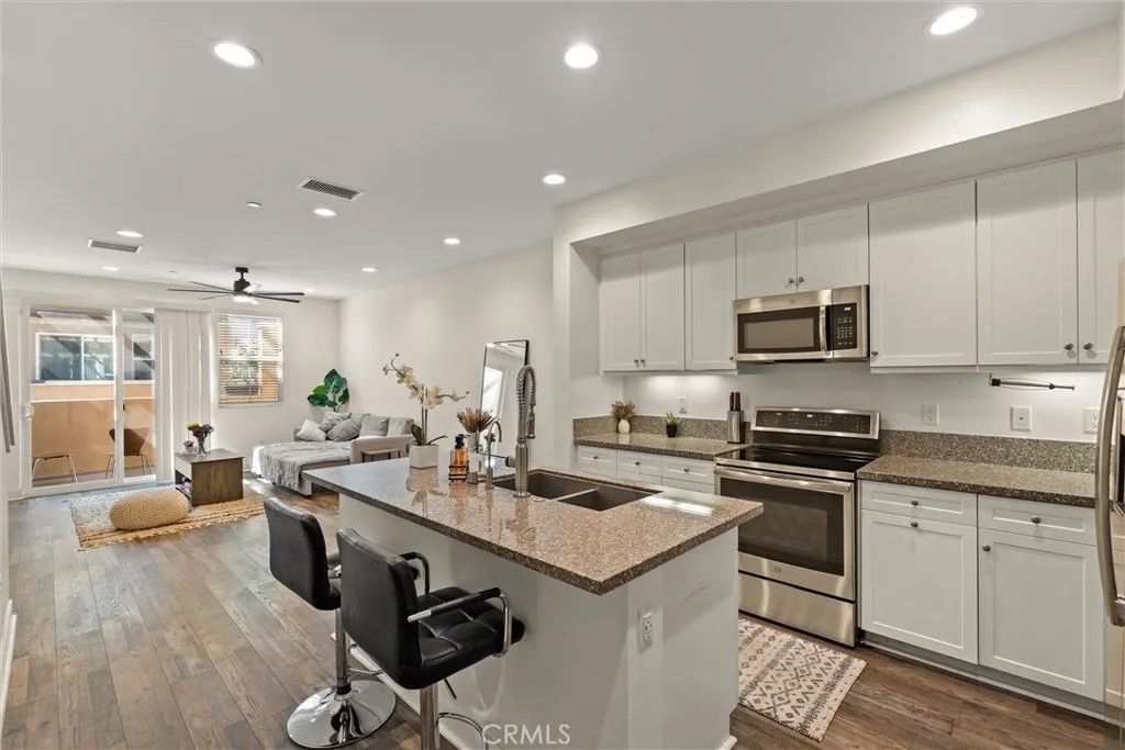 Photo of 7679 Sunflower Dr, Pico Rivera, CA 90660 (MLS # DW26059838)