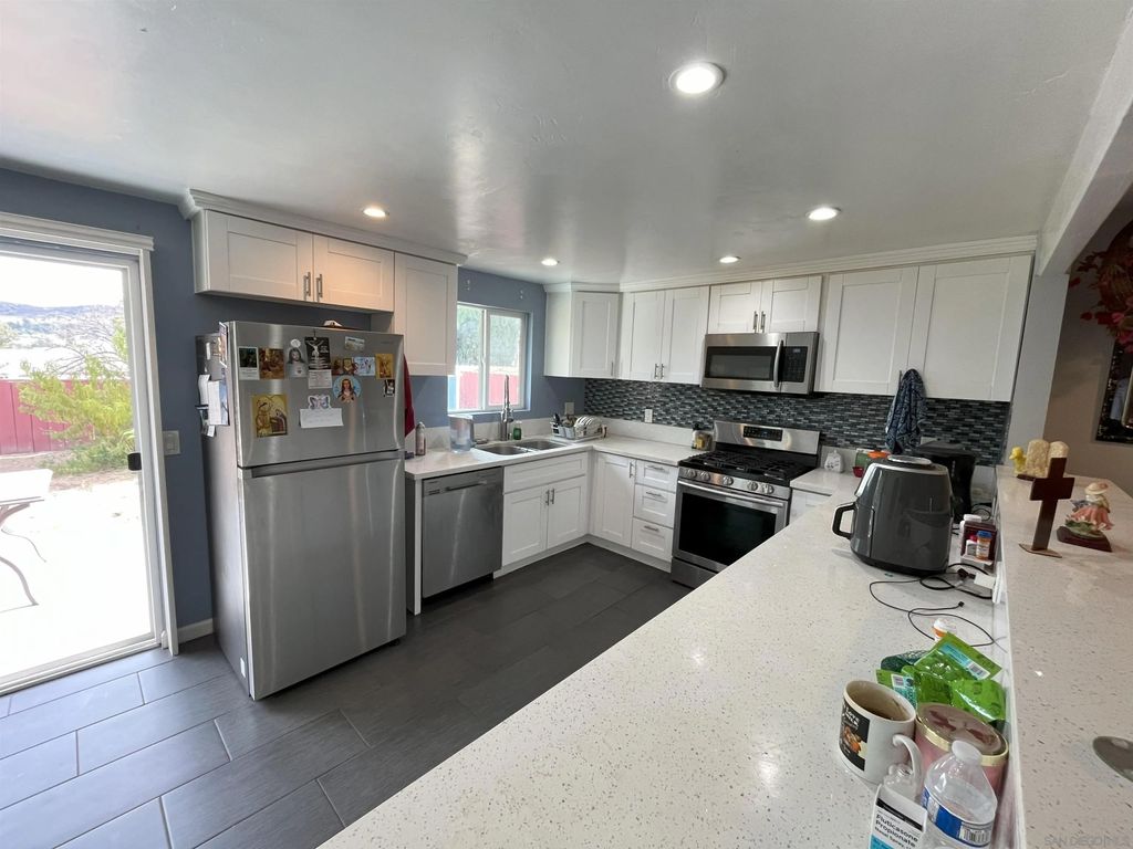 Photo of 8447 Carlton Oaks Dr, Santee, CA 92071 (MLS # 250045782)