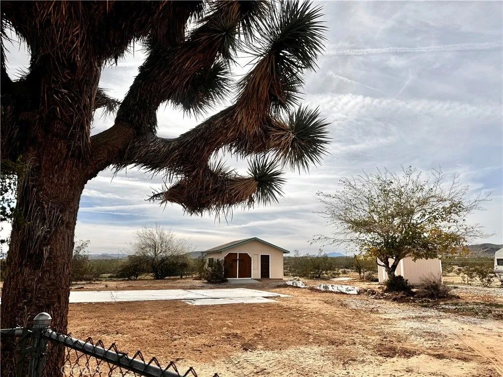 Photo of 382 Bowman Trl, Landers, CA 92285 (MLS # JT26003720)