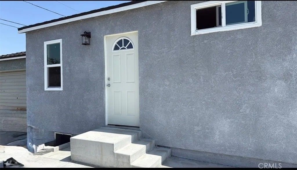 Photo of 7389 Lindsey Ave, Pico Rivera, CA 90660 (MLS # DW26003440)