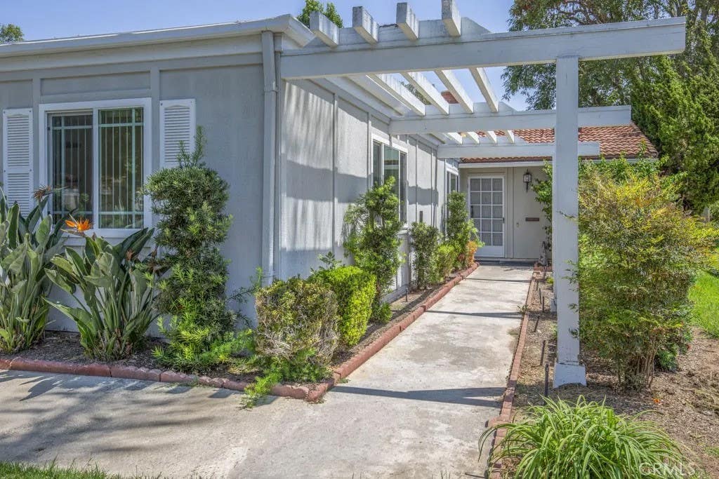 Photo of 3219 Via Carrizo #D, Laguna Woods, CA 92637 (MLS # OC26179199)