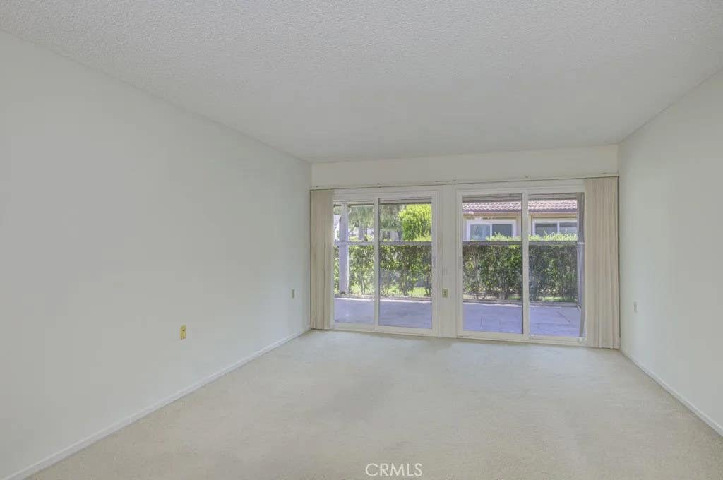 Photo of 3219 Via Carrizo #D, Laguna Woods, CA 92637 (MLS # OC26179199)