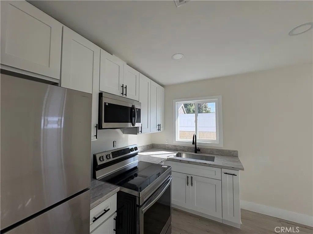 Photo of 6300 Fairbrook Street #1/2, Long Beach, CA 90815 (MLS # BB25245962)