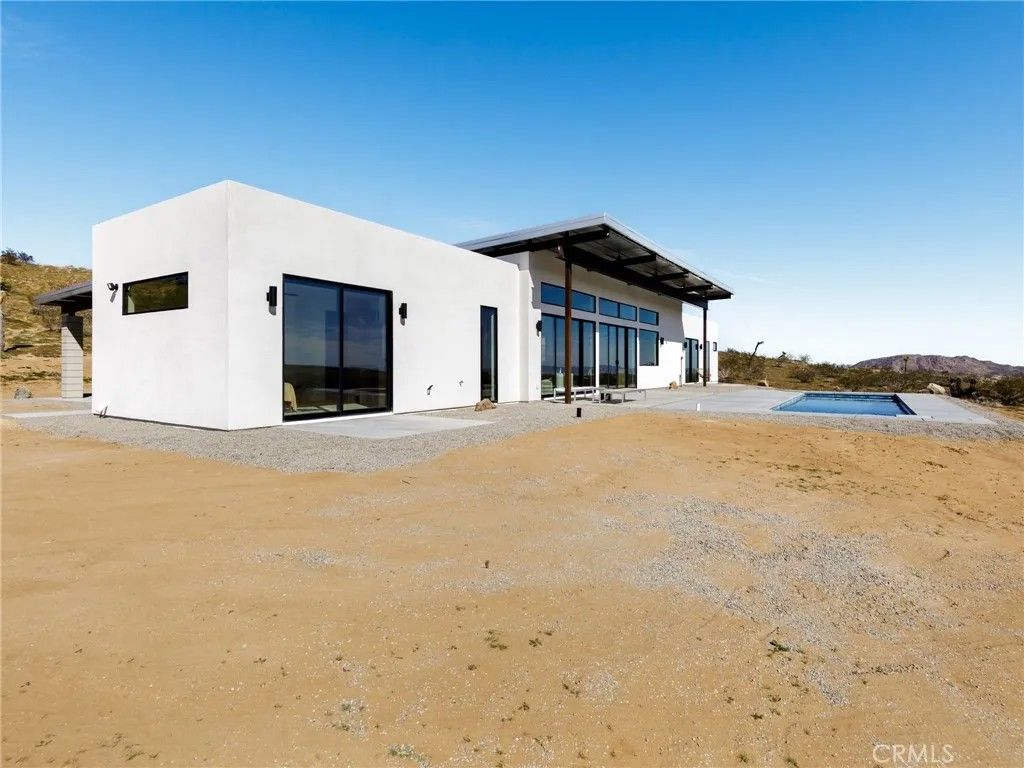 Photo of 621 N Sage Avenue, Yucca Valley, CA 92284 (MLS # JT26037458)