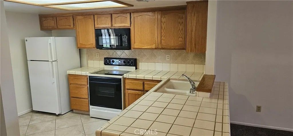 Photo of 19268 Elm Dr, Apple Valley, CA 92308 (MLS # HD26071384)