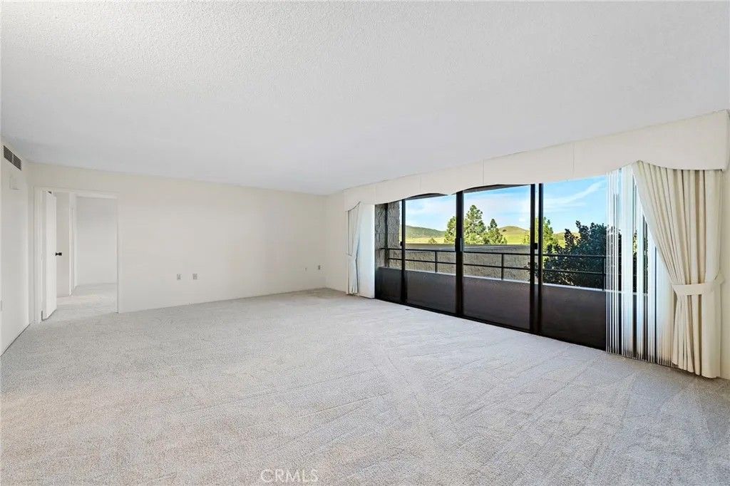 Photo of 24055 Paseo Del Lago #311, Laguna Woods, CA 92637 (MLS # OC26044164)