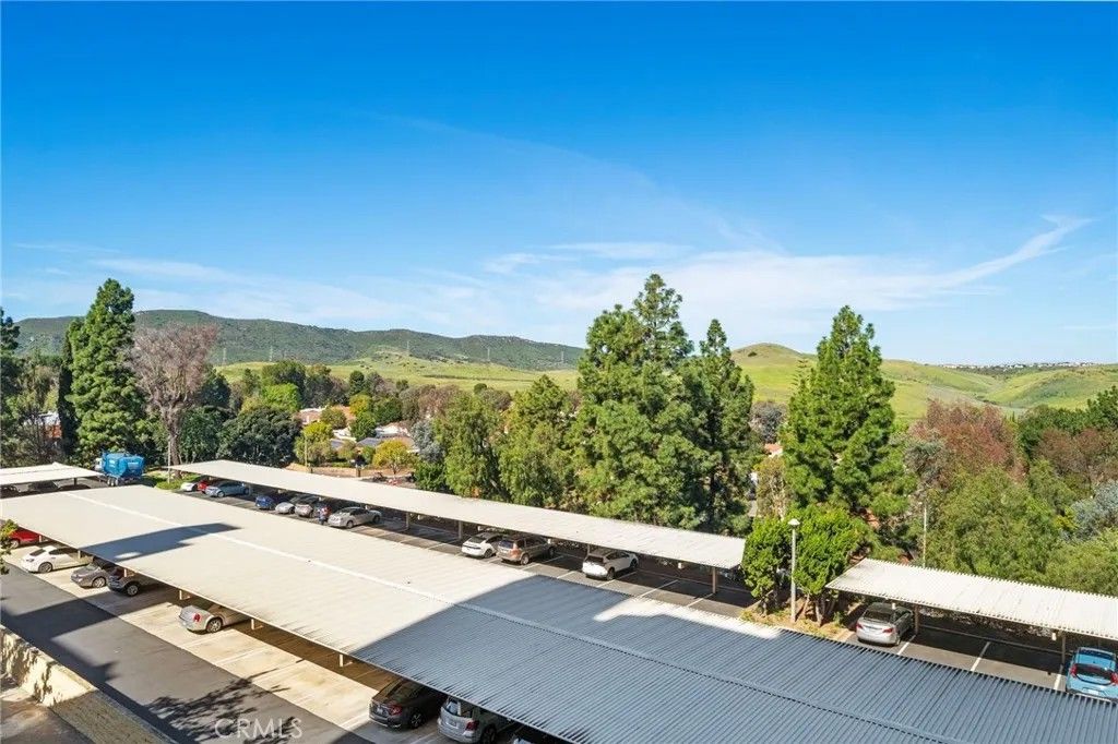 Photo of 24055 Paseo Del Lago #311, Laguna Woods, CA 92637 (MLS # OC26044164)