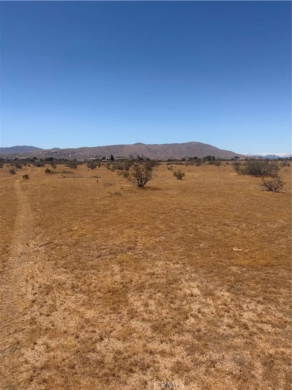 Photo of 23421 Colony Rd, Apple Valley, CA 92308 (MLS # HD26107060)