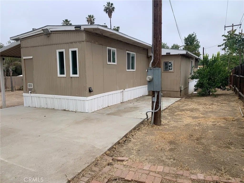 Photo of 25806 Creag Avenue, Homeland, CA 92548 (MLS # SW26090121)