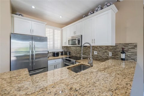 Photo of 20251 Cape Coral Ln #202, Huntington Beach, CA 92646 (MLS # OC26129179)