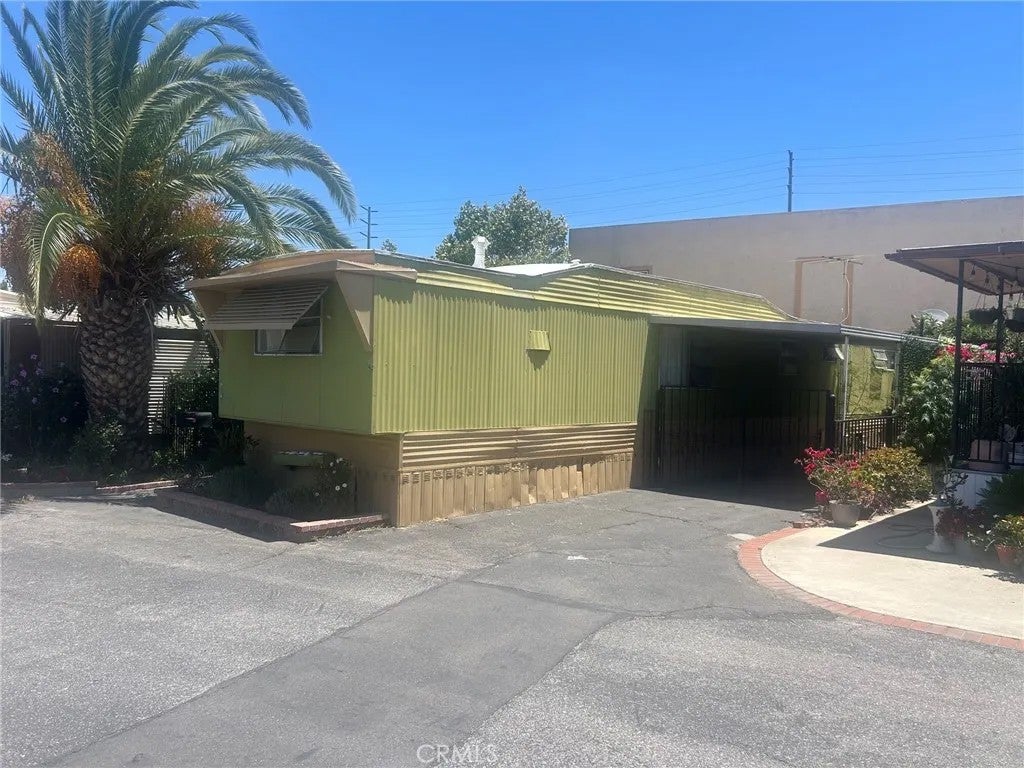 Photo of 1203 W 6th St #81, Corona, CA 92884 (MLS # PW26126208)