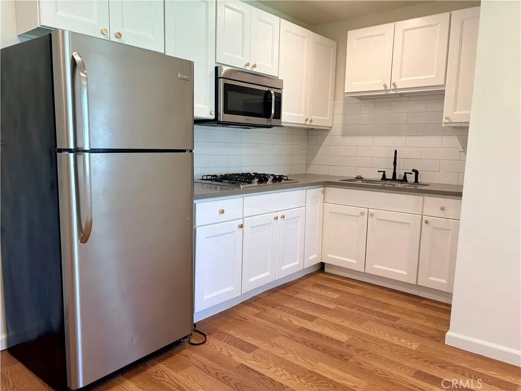 Photo of 20222 Devonshire Street, Chatsworth, CA 91311 (MLS # SR26118570)