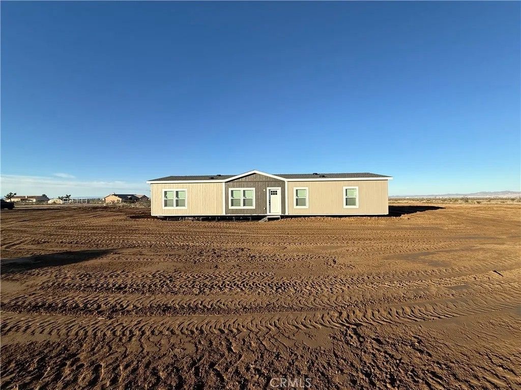Photo of 12823 Atsina Rd, Phelan, CA 92371 (MLS # SW25281124)