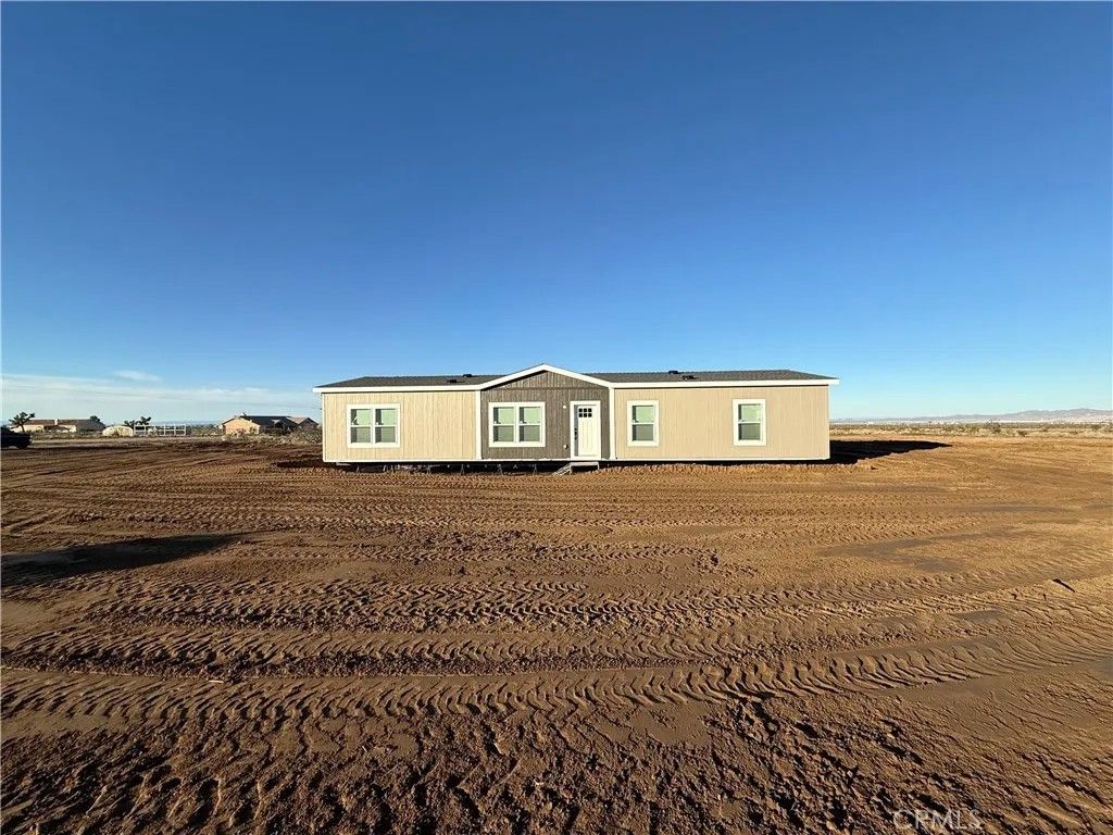 Photo of 12823 Atsina Rd, Phelan, CA 92371 (MLS # SW25281124)