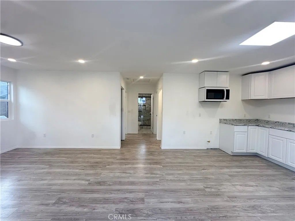 Photo of 7642 Arnett St #A, Downey, CA 90241 (MLS # DW25249149)