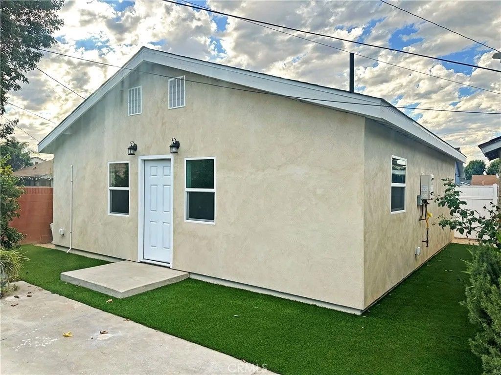 Photo of 7642 Arnett St #A, Downey, CA 90241 (MLS # DW25249149)