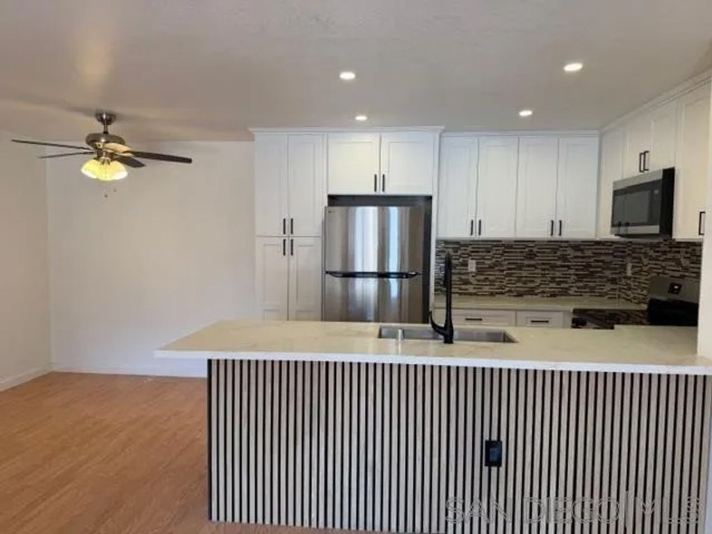 Photo of 9120 Gramercy Dr #319, San Diego, CA 92123 (MLS # 260006470)