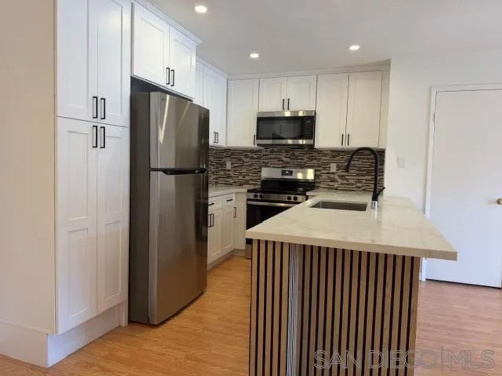 Photo of 9120 Gramercy Dr #319, San Diego, CA 92123 (MLS # 260006470)