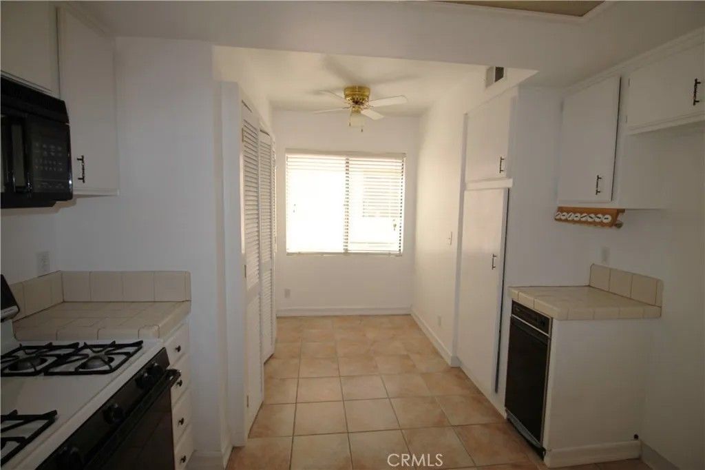 Photo of 9906 Owensmouth Ave #12, Chatsworth, CA 91311 (MLS # RS26063858)