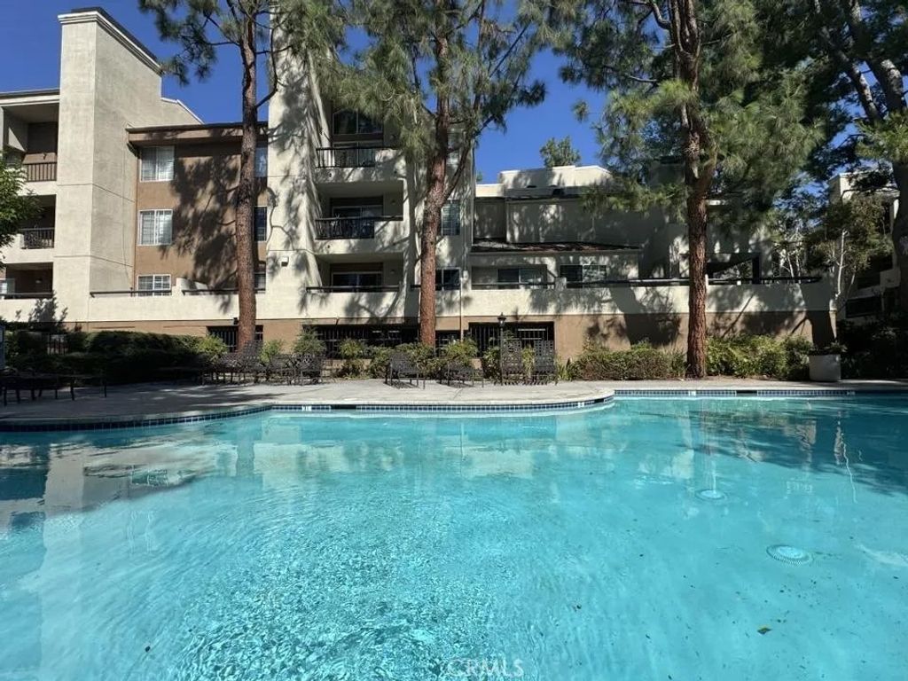 Photo of 5550 Owensmouth Ave #217, Woodland Hills, CA 91367 (MLS # SB25251033)