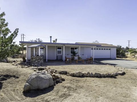 Photo of 5564 Old Woman Springs Road, Yucca Valley, CA 92284 (MLS # JT26053886)