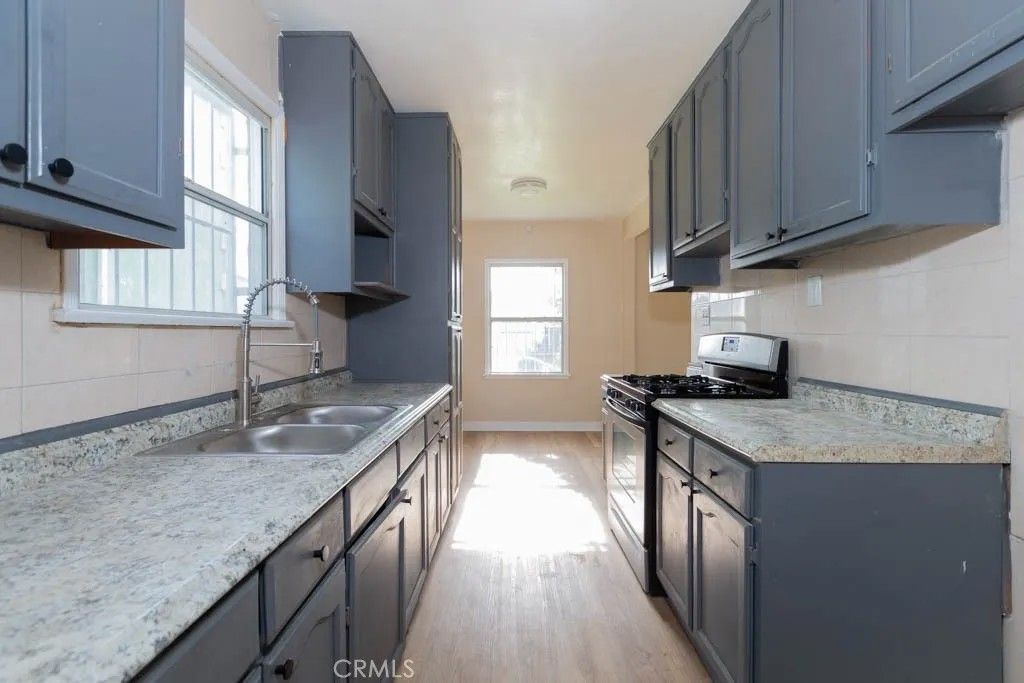 Photo of 1055 W 84th Pl, Los Angeles, CA 90044 (MLS # PW26004803)