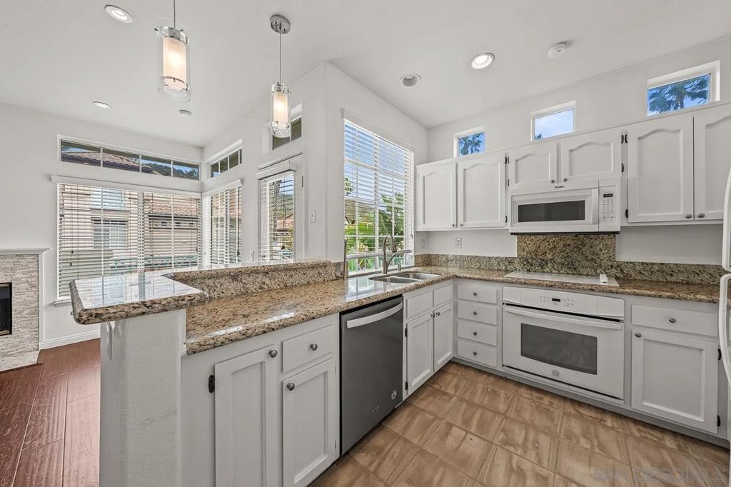 Photo of 12650 Springbrook Dr #A, San Diego, CA 92128 (MLS # 260007854)