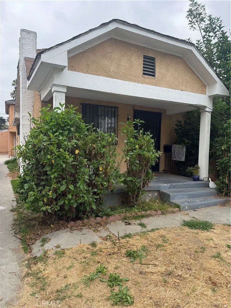 Photo of 5425 S St Andrews PL, Los Angeles, CA 90062 (MLS # PV26144478)