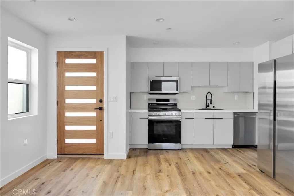 Photo of 1734 Carmona Avenue, Los Angeles, CA 90019 (MLS # BB26089566)