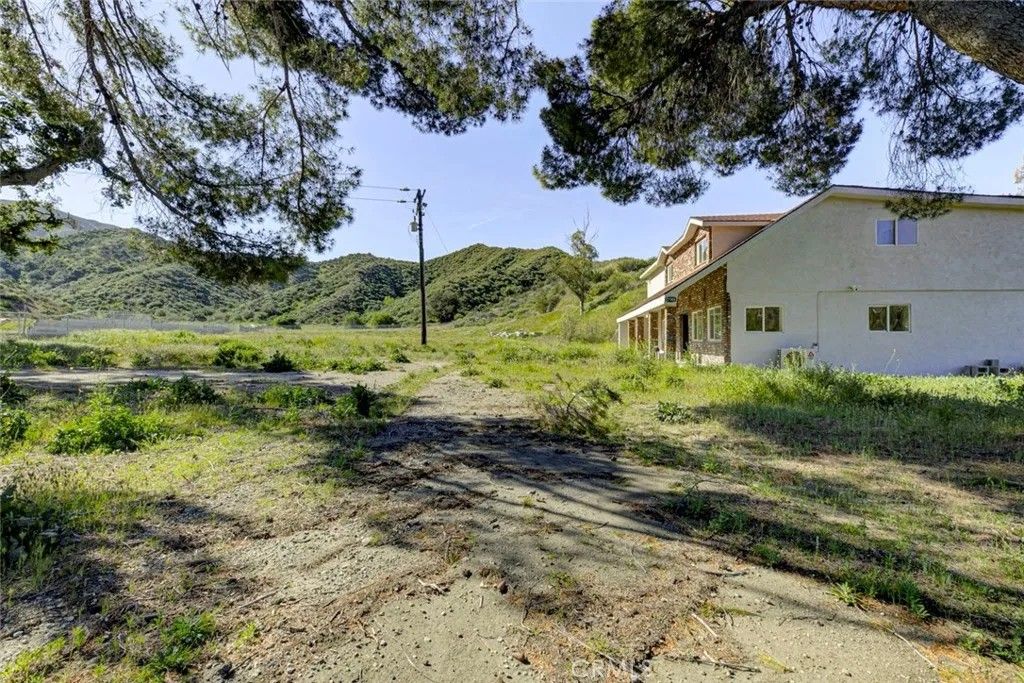 Photo of 27506 Oak Spring Canyon Road, Canyon Country, CA 91387 (MLS # GD26049097)