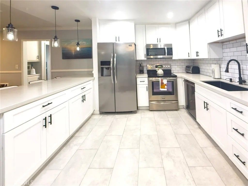 Photo of 200 Mcneil Lane #102, Newport Beach, CA 92663 (MLS # OC25265232)