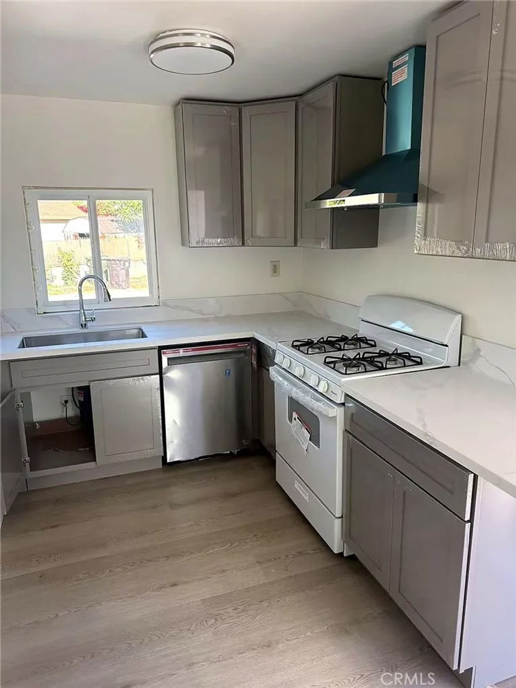 Photo of 8717 Tilmont Ave, Pico Rivera, CA 90660 (MLS # TR26056289)