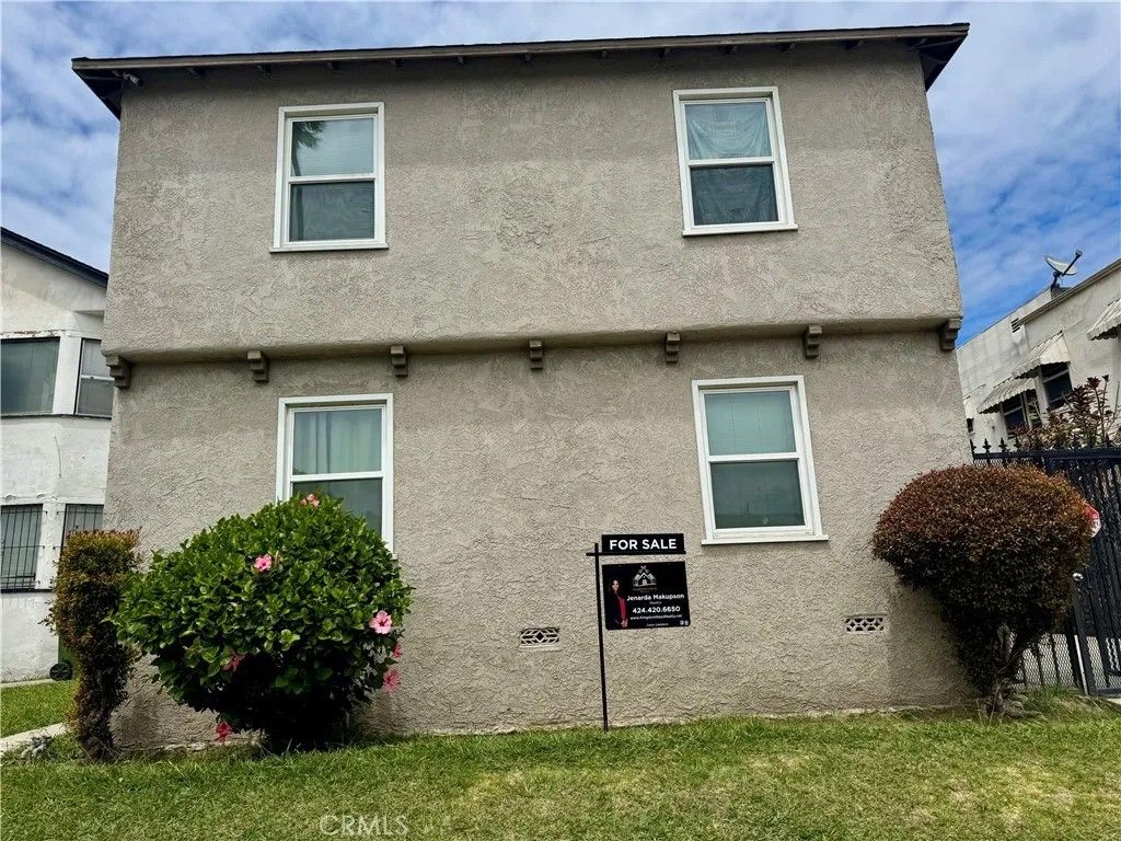 Photo of 1919 W 54th ST, Los Angeles, CA 90062 (MLS # SR26098057)