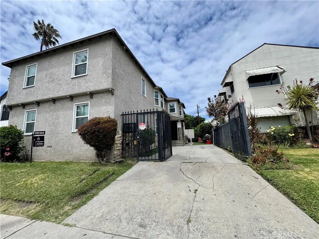 Photo of 1919 W 54th ST, Los Angeles, CA 90062 (MLS # SR26098057)