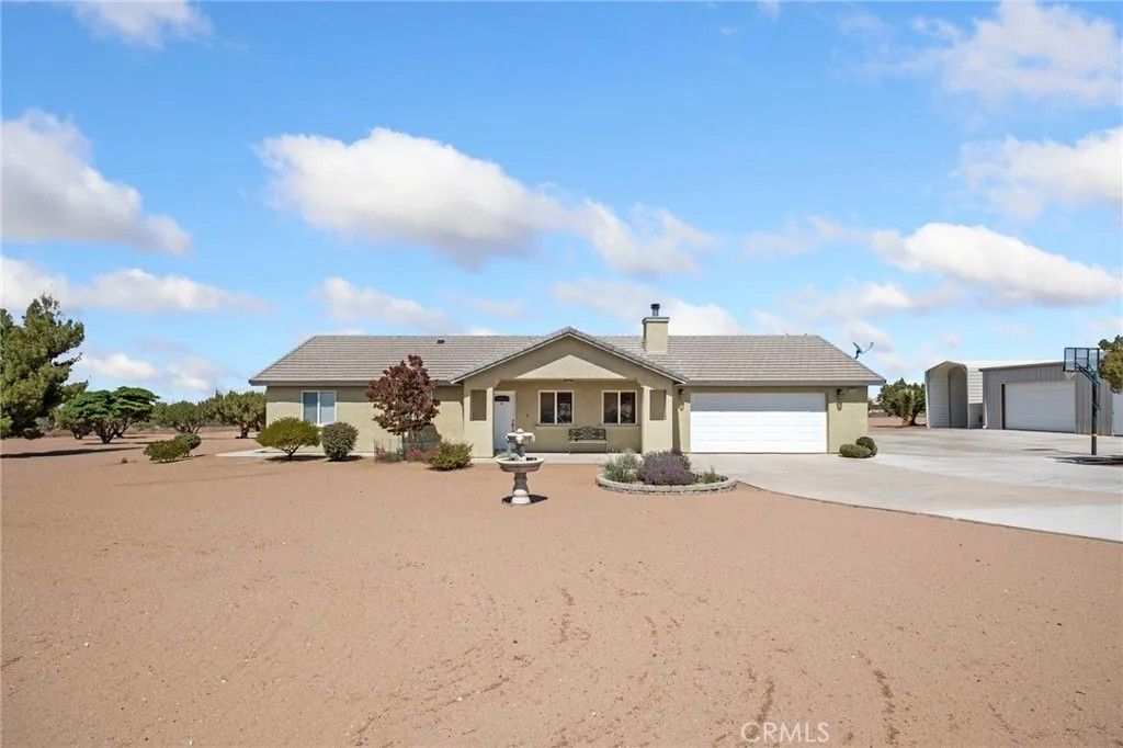 Photo of 9223 Macron Street, Oak Hills, CA 92344 (MLS # HD26091700)
