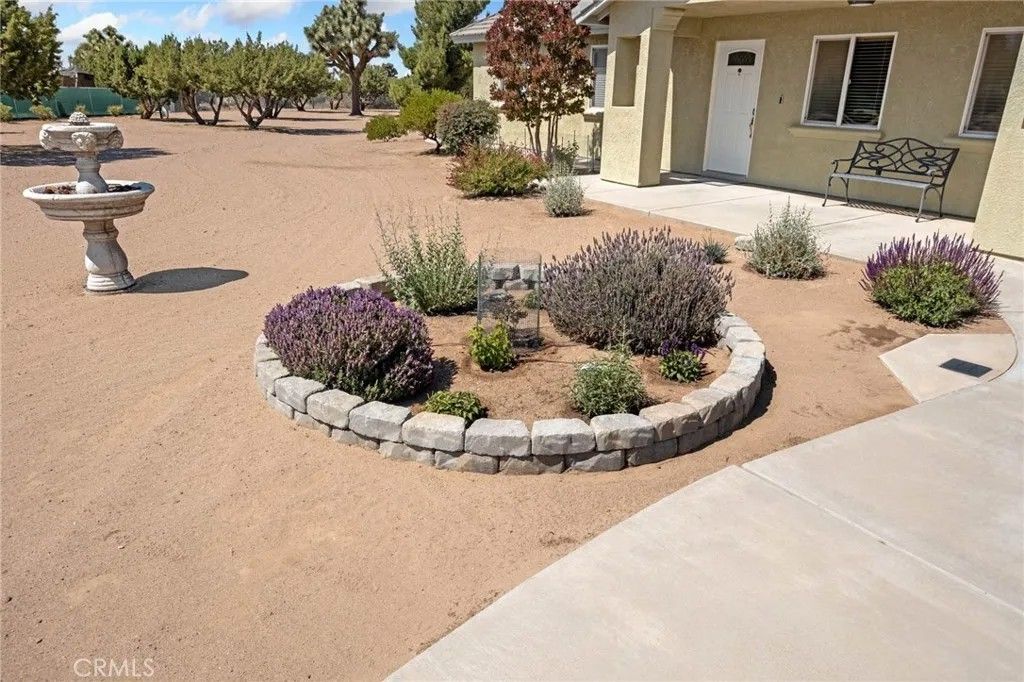 Photo of 9223 Macron Street, Oak Hills, CA 92344 (MLS # HD26091700)