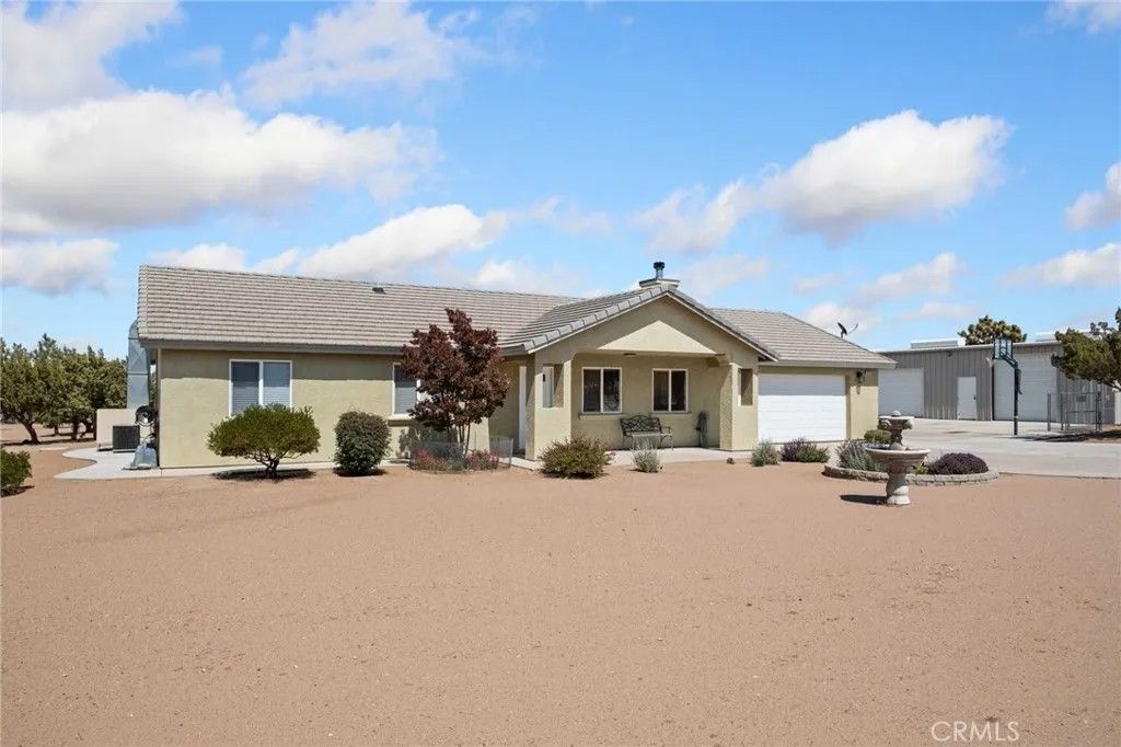Photo of 9223 Macron Street, Oak Hills, CA 92344 (MLS # HD26091700)