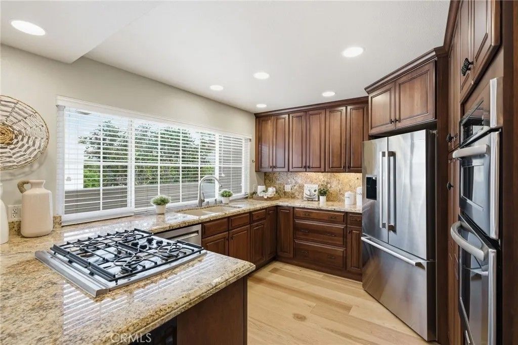 Photo of 19281 Meadowood Cir, Huntington Beach, CA 92648 (MLS # OC25281857)