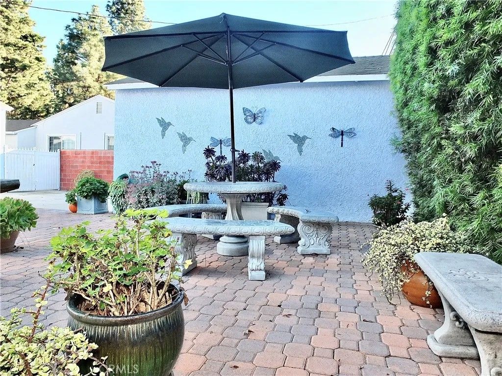 Photo of 3913 Knoxville Avenue, Long Beach, CA 90808 (MLS # RS26004983)