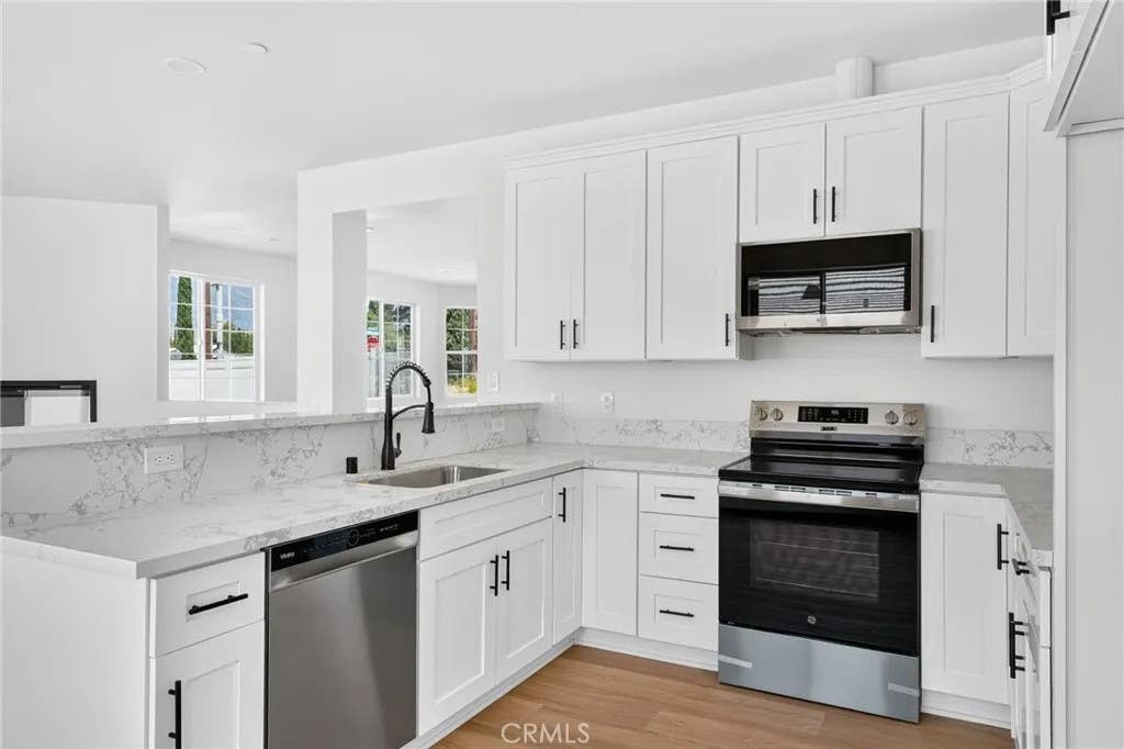 Photo of 595 E 12th Street, Beaumont, CA 92223 (MLS # DW26185219)
