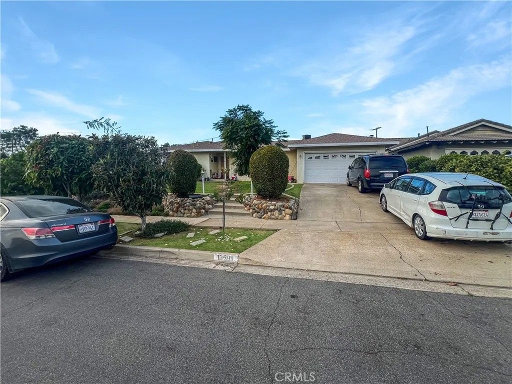 Photo of 12591 Charloma Dr, Tustin, CA 92780 (MLS # OC25270776)