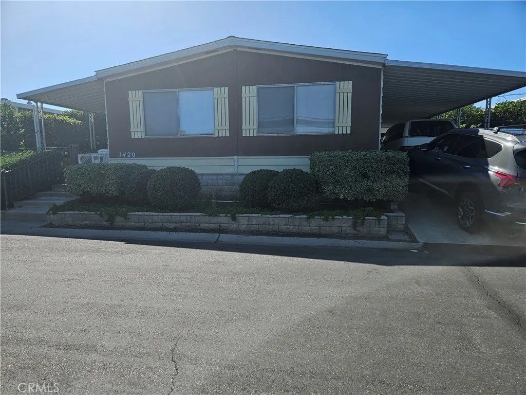 Photo of 1439 Ridgemont Way, Corona, CA 92882 (MLS # IG25252162)
