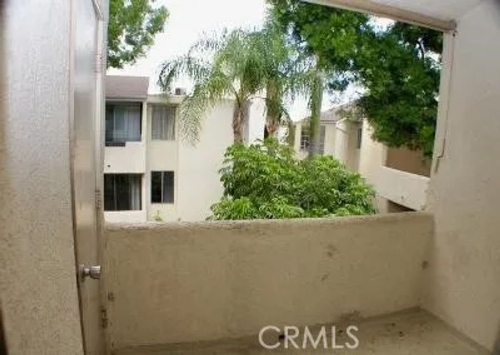 Photo of 5325 Newcastle Ave #322, Encino, CA 91316 (MLS # SR26093375)