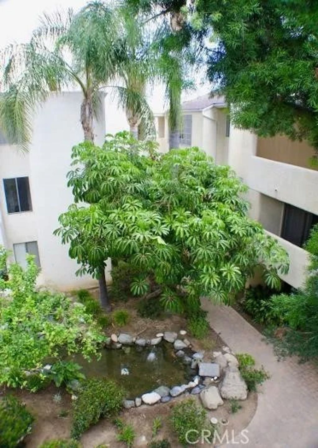 Photo of 5325 Newcastle Ave #322, Encino, CA 91316 (MLS # SR26093375)