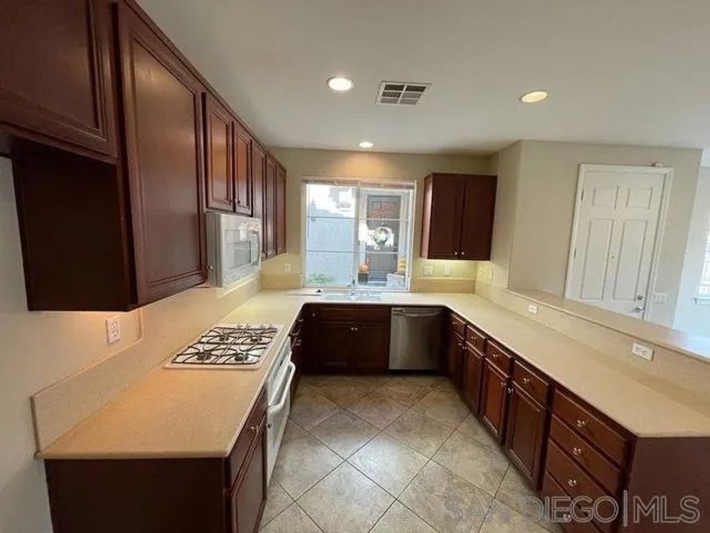 Photo of 2116 Cantata Dr #44, Chula Vista, CA 91914 (MLS # 250044269)