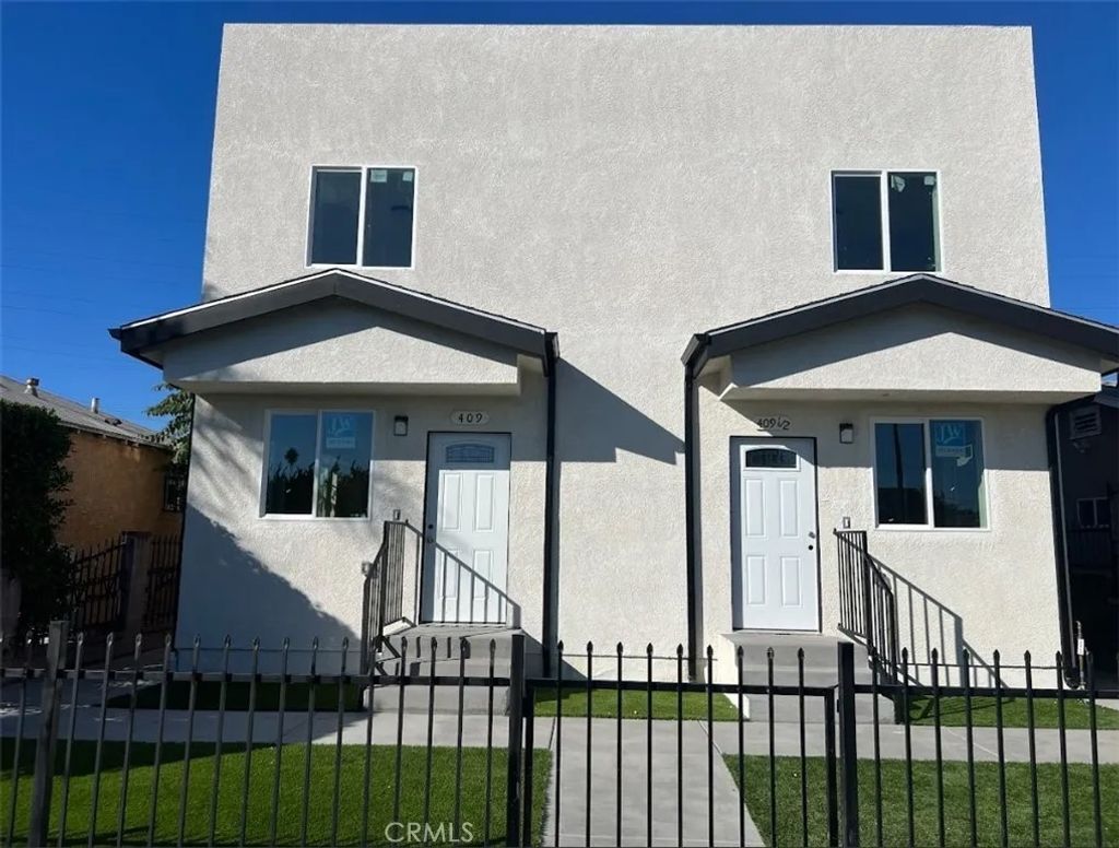 Photo of 411 E 99th Street, Los Angeles, CA 90003 (MLS # PW25272823)
